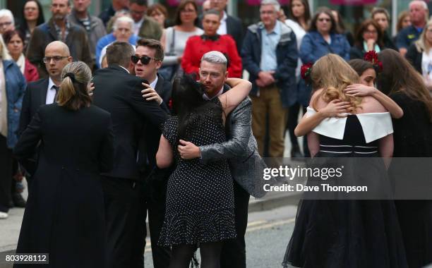 Martyn Hett's partner Russell Hayward greets mourners as the arrive for the funeral of Martyn Hett at Stockport Town Hall on June 30, 2017 in...