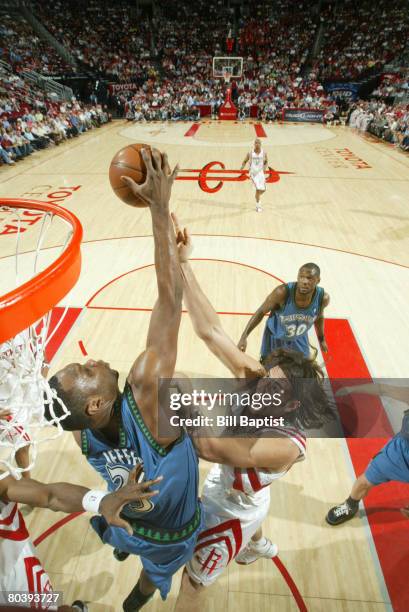 Al Jefferson of the Minnesota Timberwolves blocks Luis Scola of the Houston Rockets on March 26, 2008 at the Toyota Center in Houston, Texas. NOTE TO...