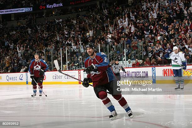 Peter Forsberg of the Colorado Avalanche celebrates Milan Hejduk's 2nd goal against the Vancouver Canucks at the Pepsi Center on March 26, 2008 in...