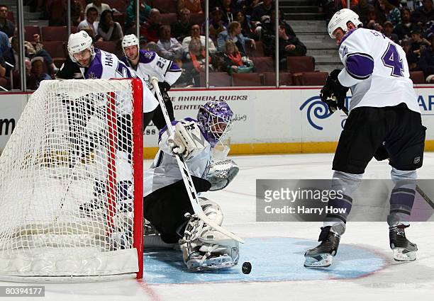 Erik Erserg of the Los Angeles Kings makes a toe save in front of Rob Blake, Michal Handzus and Jon Klemm against the Anaheim Ducks during the third...