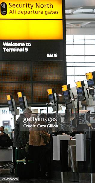 Passengers check-in in the departures area of Terminal 5 on March 27, 2008 in London, England. Terminal 5 opens to the public for its first day of...