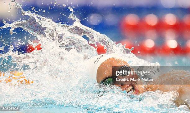 Lisbeth Trickett of Queensland celebrates after breaking the world record in the womens 100 metre final during day six of the 2008 Australian...