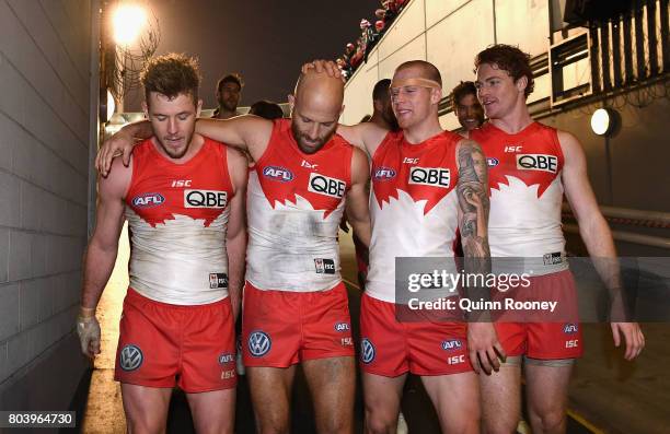 Luke Parker, Jarrad McVeigh, Zak Jones and Gary Rohan of the Swans celebrate as they walk into the rooms the round 15 AFL match between the Melbourne...