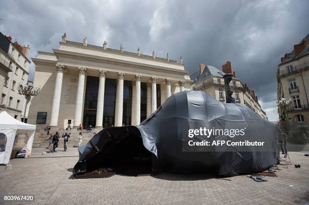 The artwork "Hecate" by French artist Nicolas Darrot is pictured in Nantes, western France, on June 29, 2017 during the 6th edition of the "A journey...