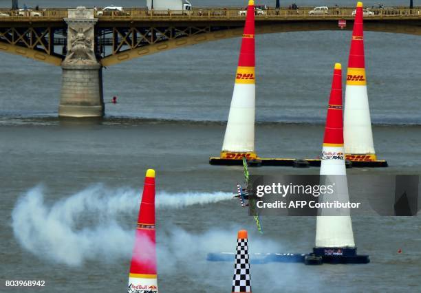 Czech Petr Kopfstein flies over the Danube river with his Zivko Edge 540 plane during the practice session of the Red Bull Air Race World...