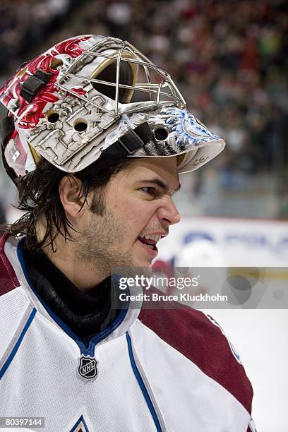 Jose Theodore of the Colorado Avalanche talks with some of his teammates during a break in the game against the Minnesota Wild at Xcel Energy Center...