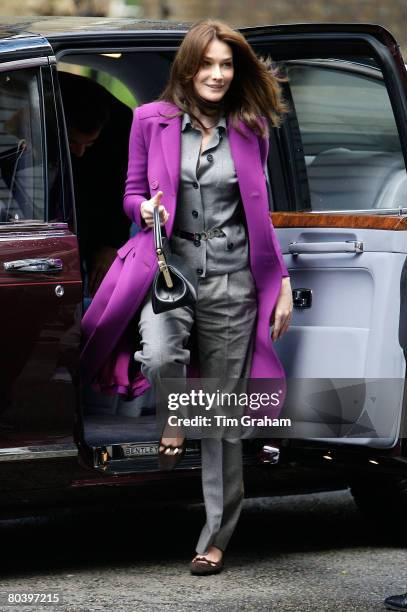 First Lady of France Carla Bruni-Sarkozy arrives with her husband French President Nicolas Sarkozy in the Queen's Bentley limousine to meet Prime...