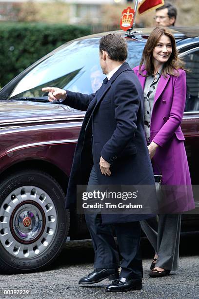 First Lady of France Carla Bruni-Sarkozy arrives with her husband French President Nicolas Sarkozy in the Queen's Bentley limousine to meet Prime...