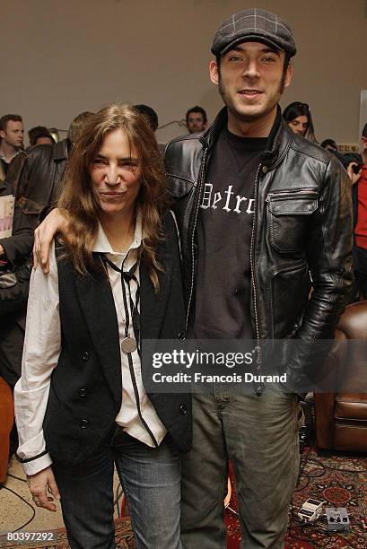 Veteran rocker Patti Smith poses with her son Jackson during an exhibition called 'Patti Smith, land 250' at the Fondation Cartier on March 27, 2008...