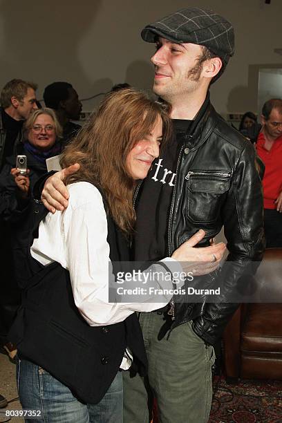 Veteran rocker Patti Smith poses with her son Jackson during an exhibition called 'Patti Smith, land 250' at the Fondation Cartier on March 27, 2008...
