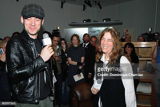 Patti Smith and her son Jackson attend the Patti Smith exhibition "Land 250" presented by La Fomndation Cartier on March 27, 2008 Paris, France.
