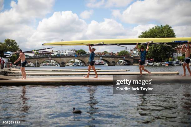 Rowing crew carry their boat following a race at the Henley Royal Regatta on June 30, 2017 in Henley-on-Thames, England. The five day Henley Royal...