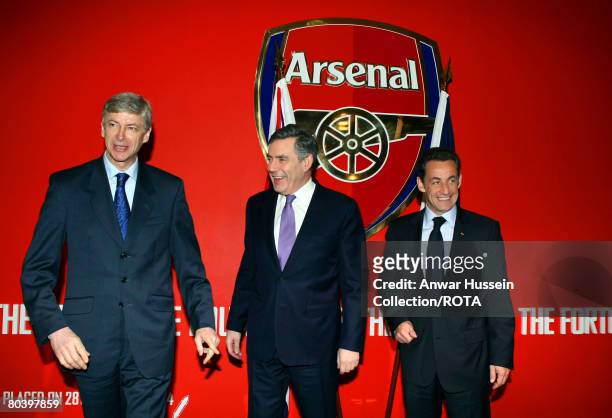 Prime Minister Gordon Brown and France's President Nicolas Sarkozy are seen with French Arsenal Manager Arsene Wenger during a meeting at the...