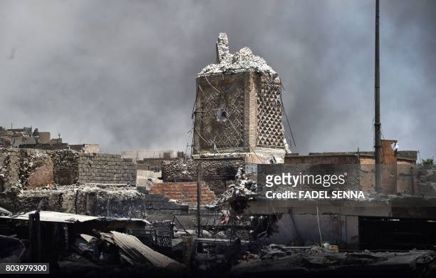 Picture taken on June 30, 2017 shows the base of Mosul's destroyed ancient leaning minaret, known as the "Hadba" , in the Old City after the area was...