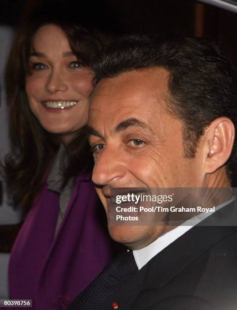 French President Nicolas Sarkozy and his wife Carla Bruni-Sarkozy leave Windsor Castle by limousine on the second day of their State Visit on March...
