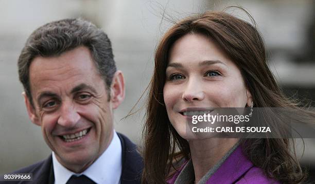 France's President Nicolas Sarkozy and his wife Carla Bruni-Sarkozy are pictured at the Old Royal Naval College in London, on March 27 where the...