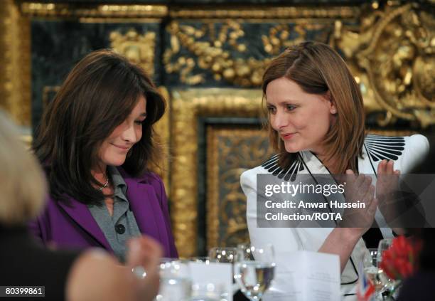 British Prime minister's wife Sarah Brown applauds First Lady of France Carla Bruni-Sarkozy after she delivers a speech for the White Ribbon Alliance...