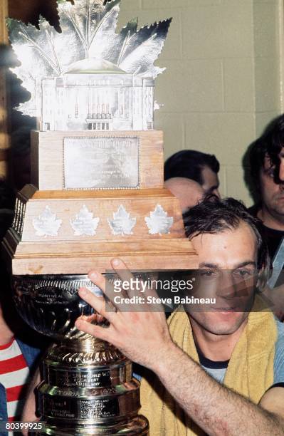 Guy Lafleur of the Montreal Canadiens celebrates winning the Stanley Cup and Conn Smythe trophy post game against the Boston Bruins at Boston Garden.