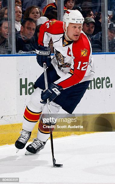 Olli Jokinen of the Florida Panthers controls the puck against the Tampa Bay Lightning at St. Pete Times Forum on March 25, 2008 in Tampa, Florida.