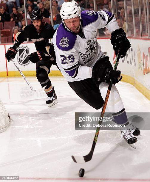 Jon Klemm of the Los Angeles Kings drives the puck behind the net against the Anaheim Ducks at the Honda Center March 26, 2008 in Anaheim, California.