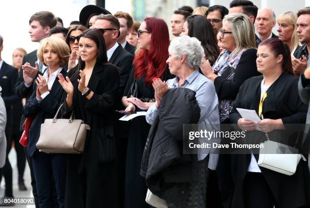 Coronation Street actor Helen Worth applauds with fellow mourners at the end of the funeral of Martyn Hett at Stockport Town Hall on June 30, 2017 in...