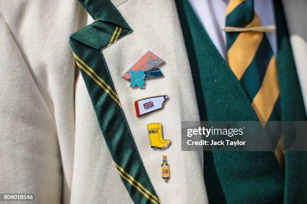 Collection of badges sit on the lapel of a spectator at the Henley Regatta on June 30, 2017 in Henley-on-Thames, England. The five day Henley Royal...