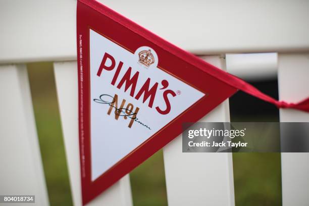 Pimm's bunting hangs over a fence at the Henley Regatta on June 30, 2017 in Henley-on-Thames, England. The five day Henley Royal Regatta is now in...