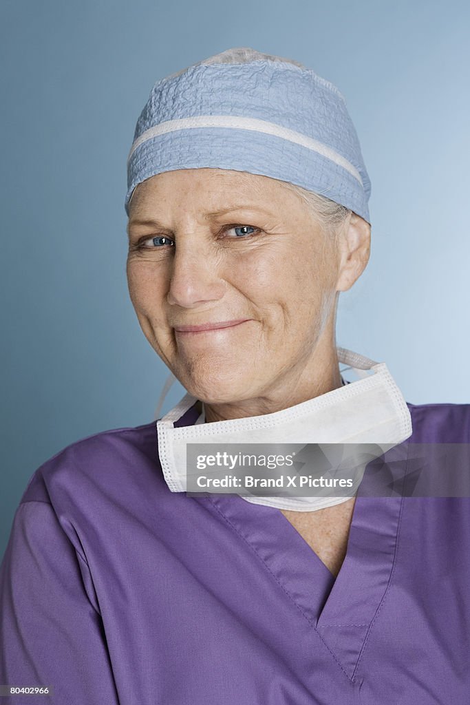 Smiling surgeon wearing scrubs