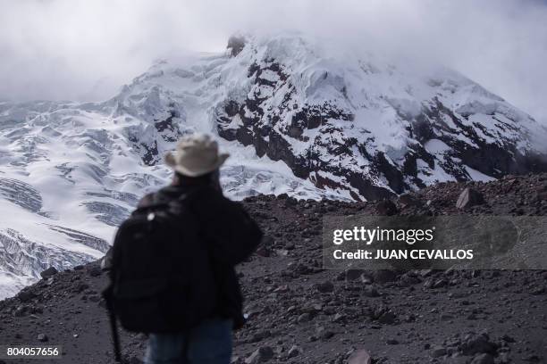 Guest of the French Development Research Institute for an ascent of Antisana Volcano to raise awareness on global warming, looks at a glacier on June...