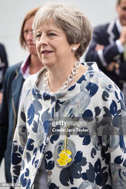 British Prime Minister Theresa May leaves the Stewards' Enclosure at the Henley Royal Regatta on June 30, 2017 in Henley-on-Thames, England. The five...