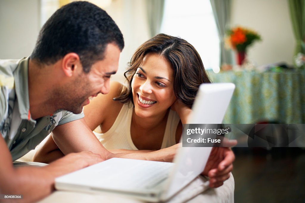 Couple Using Laptop