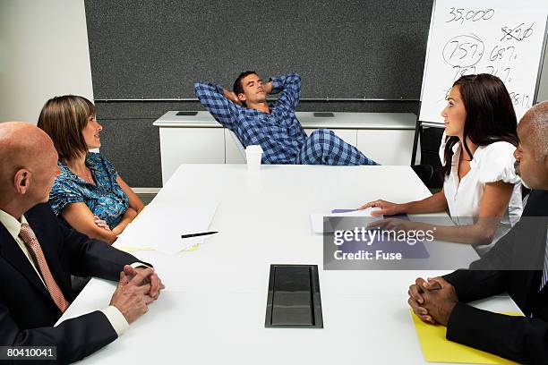 businessman sleeping in meeting - pajamas fotografías e imágenes de stock