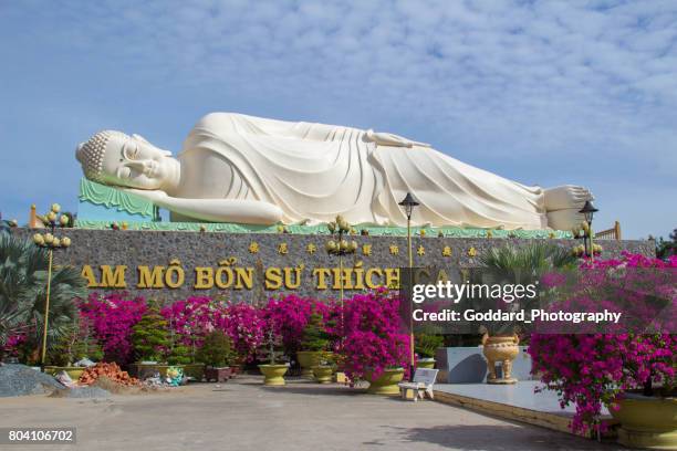 vietnam: vinh trang temple - reclining buddha statue stock pictures, royalty-free photos & images