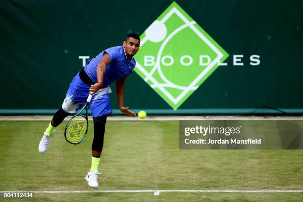 Nick Kyrgios of Australia serves during his match against Viktor Troicki of Serbia during day four of The Boodles Tennis Event at Stoke Park on June...