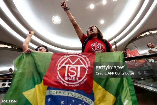 Members of the Roofless Movement call for Brazilian President Michel Temer to step down and protest against his proposed economic reforms, at Sao...