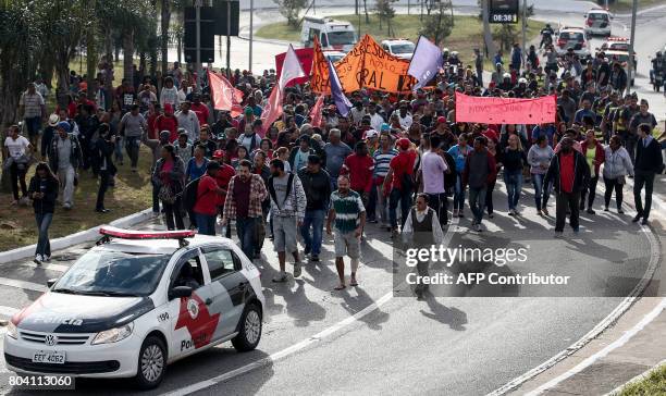 Members of the Roofless Movement protest against President Michel Temer's proposed economic reforms, outside Sao Paulo's Congonhas Airport, on June...