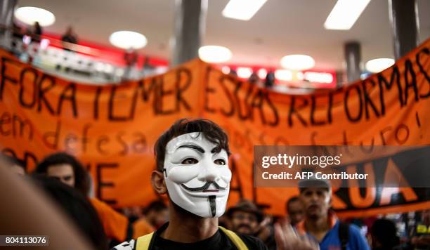 Members of the Roofless Movement call for Brazilian President Michel Temer to step down and protest against his proposed economic reforms, at Sao...