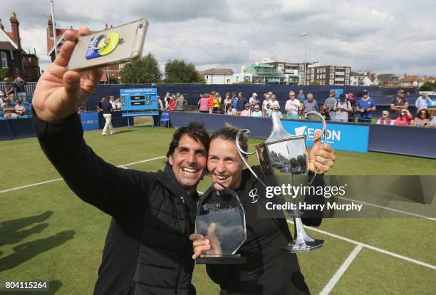 Tatjana Maria of Germany poses for a selfie with her husband and coach Charles Edouard Maria after the Aegon Southsea Trophy final match between...