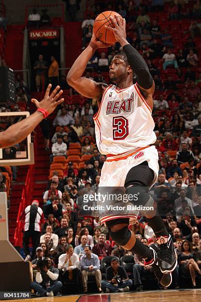Dwyane Wade of the Miami Heat takes a jumpshot against the Cleveland Cavaliers during the game at the American Airlines Arena on January 21, 2008 in...