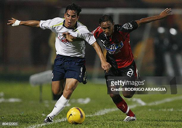 Omar Bravo of Mexico`s Chivas vies for the ball with Elvis Gonzalez of Colombia`s Cucuta Deportivo during their Copa Libertadores match on March 27,...