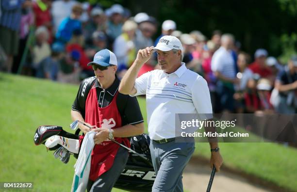 Fred Couples acknowledges the gallery on the 18th green during the second round of the American Family Insurance Championship held at University...