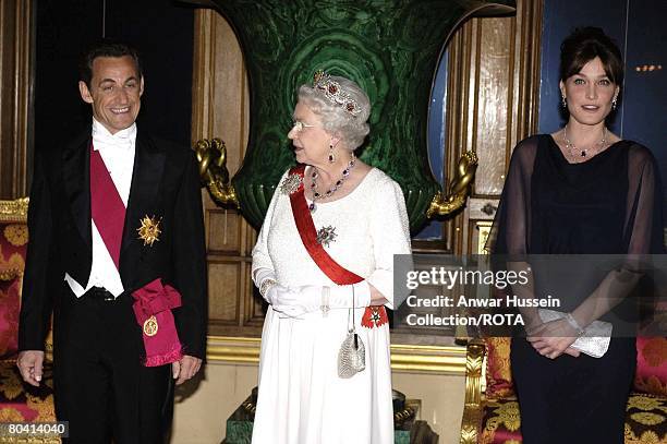 Queen Elizabeth ll, French President Nicolas Sarkozy and Carla Bruni-Sarkozy arrive for a State Banquet at Windsor Castle on March 26, 2008 in...