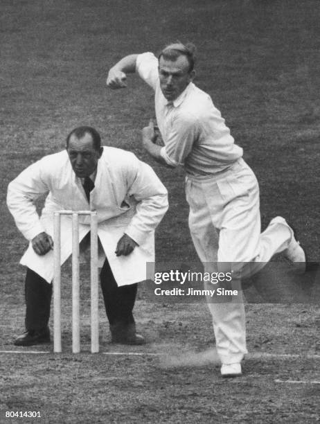 English cricketer Tony Lock bowls for Surrey at the Oval, 1952.