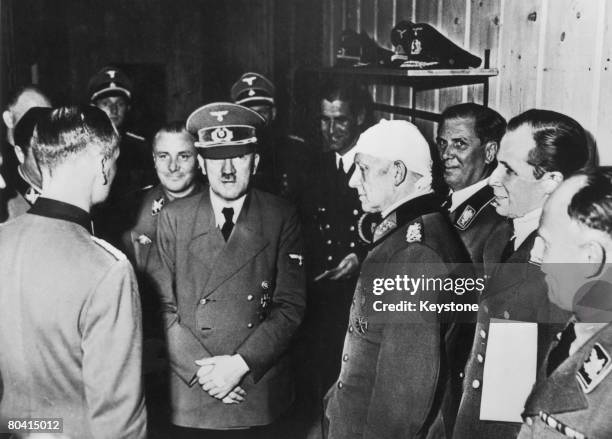 From left to right, Martin Bormann, Adolf Hitler , Alfred Jodl, A. Borman, Below and Captain Baur at Hitler's headquarters in Rastenburg , East...
