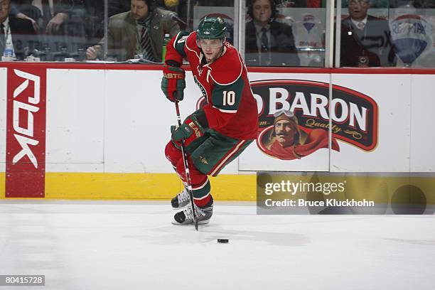 Marian Gaborik of the Minnesota Wild handles the puck against the Colorado Avalanche during the game at Xcel Energy Center on March 17, 2008 in Saint...