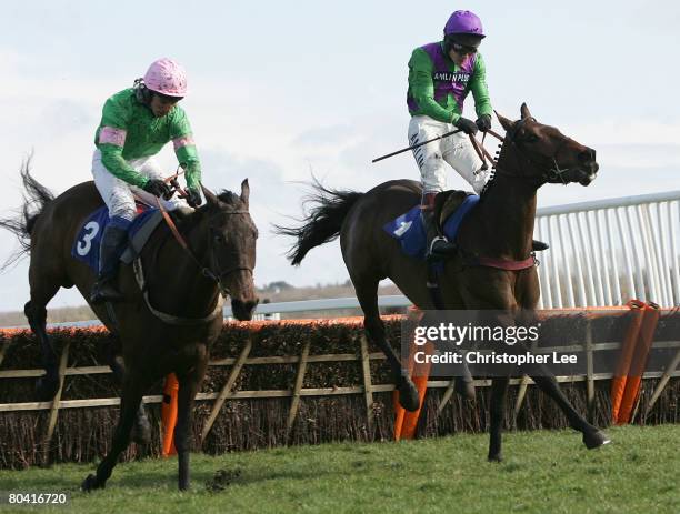 Jockey Richard Johnson riding Ballydub battles with Jockey Mr O Greenall riding Canalturn to win The Sabin Du Loir Memorial Maiden Hurdle Race at...