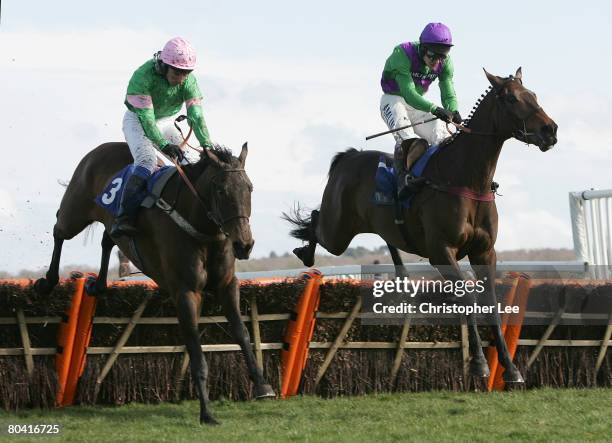 Jockey Richard Johnson riding Ballydub battles with Jockey Mr O Greenall riding Canalturn to win The Sabin Du Loir Memorial Maiden Hurdle Race at...