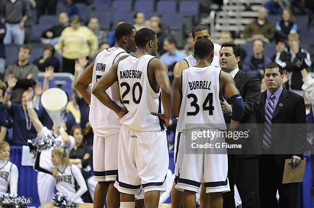 Head coach Sean Miller of the Xavier Musketeers talks to his team during a NCAA Men's Basketball 2nd round game against the Purdue Boilermakers at...