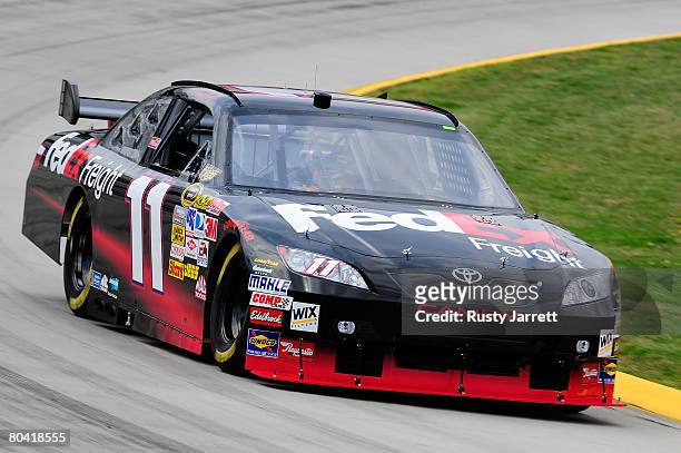 Denny Hamlin, driver of the FedEx Freight Toyota, drives during practice for the NASCAR Sprint Cup Series Goody's Cool Orange 500 at Martinsville...