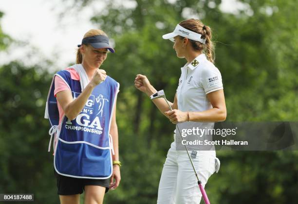 Klara Spilkova of the Czech Republic celebrates a birdie putt with her caddie on the seventh hole during the second round of the 2017 KPMG Women's...